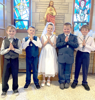 MAKINGTHEIR FIRST HOLY COMMUNION at St.Thomas Church on Sunday, April 28th, were Ira Beall, Grandon Mongeau, Charlotte Berkley, Trent Look, and Grayson Brown.
