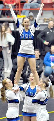 SHS Cheerleaders perform a stunt at state wrestling L to r: Ella Snyder, Claire Plumer (top) Karleigh Horn and Ava Dix