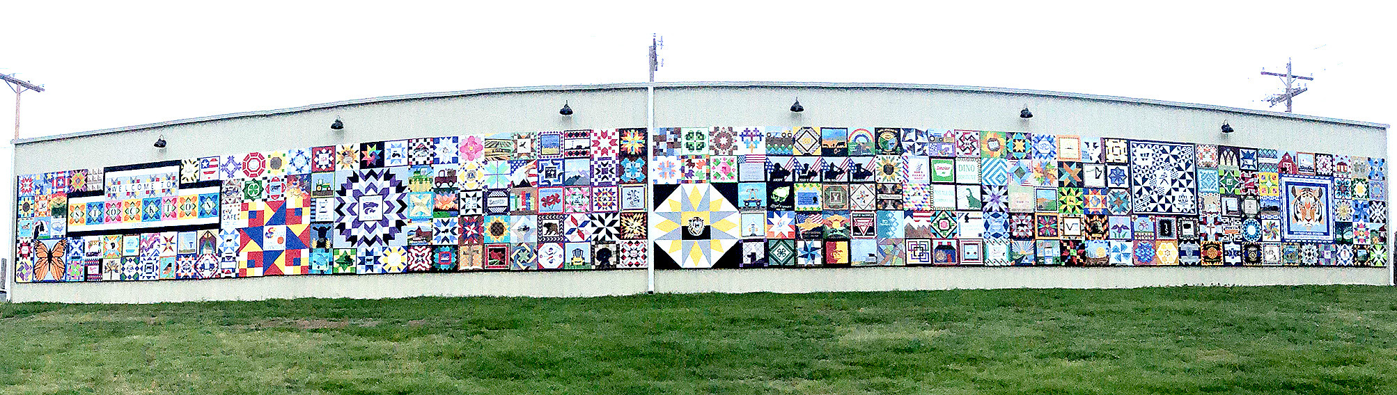 A PANORAMICVIEW of the massive Barn Quilt Mural in Stockton shows off all 295 blocks hand-painted by many community members. This finishes the project's second phase of painting and hanging all the blocks, with only the signage portion left. The final phase should be completed within the next six months.