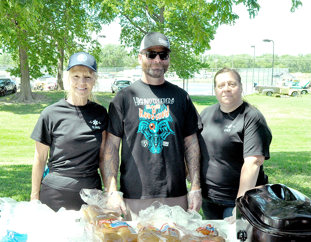 Rooks County EMS personnel Corrine Dix, Spencer Hilbrink and Charlotte Dick serving lunch at the Car Show