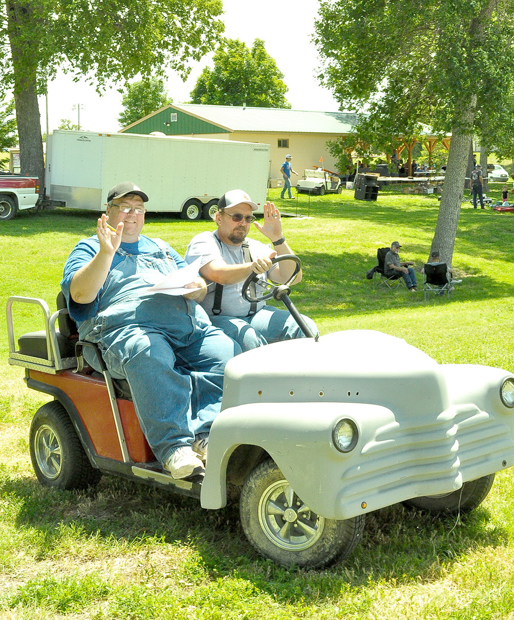 STOCKTON RODDERS’ members Dean Kester and Adam Bryant make the rounds during Saturday’s Car Show which was held in Stockton City Park. The much-anticipated annual event was also sponsored by the City of Stockton, Rooks County EMS, and Stockton Chamber of Commerce.